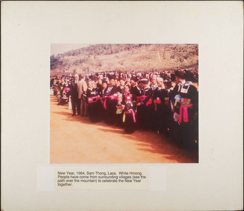 White HMong Villagers Gathering Near Mountain in Laos