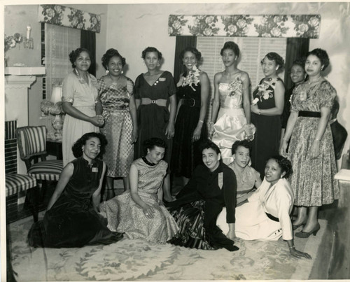 Women at a Les Unique Social Club installation event, where newly elected club officers were sworn in