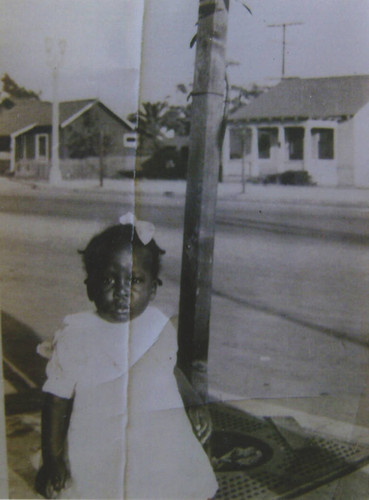 Celestine 'Suzie' Clisby Ellis, age 3, in front of 'Suzie's tree' on Broadway between 18th and 19th Streets