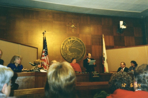 Tony Vasquez reading a proclamation at City Council meeting, December 6, 1994