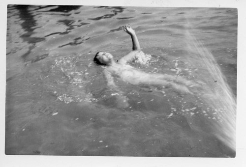 Judy Abdo (nee Ulrich) swimming in a lake