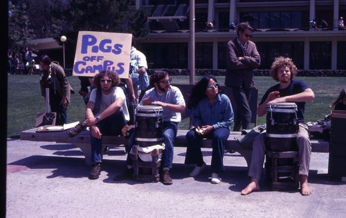 Sign "Pigs off campus" on Revelle Plaza, UC San Diego