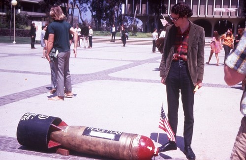 UC San Diego student looking at bomb on Revelle Plaza, UC San Diego