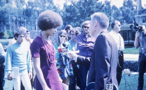 Angela Davis being interviewed by media on Revelle Plaza, UC San Diego