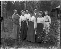 Group of men and women outside, c. 1912