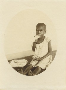 Girl eating, in Gabon
