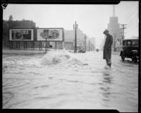 Overflowing manhole on rain-flooded city street, [Los Angeles County?], 1933