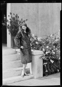 Model & fur coat on roof garden, Southern California, 1929