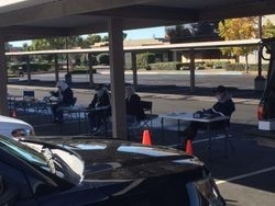 Masked Sonoma County Radio Amateurs (SCRA) VE testing volunteers standing in a circle in a parking lot on Stony Point Road, Santa Rosa, California, 14 November 2020