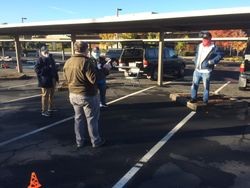 Masked Sonoma County Radio Amateurs (SCRA) VE testing volunteers standing in a parking lot on Stony Point Road, Santa Rosa, California, 14 November 2020