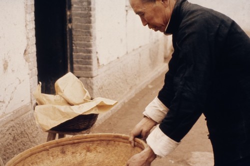 Man with bamboo sieve (2 of 2)
