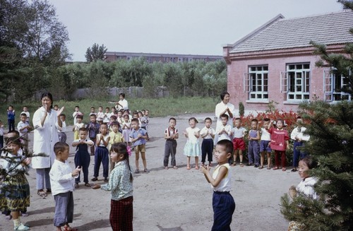 Daycare center visit, children and teachers welcoming visitors (2 of 3)