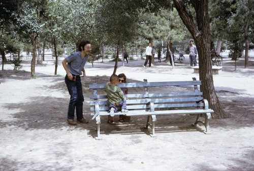American visitors and boy in a park