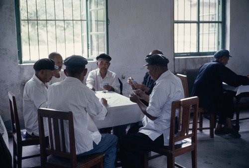 Older men playing card games