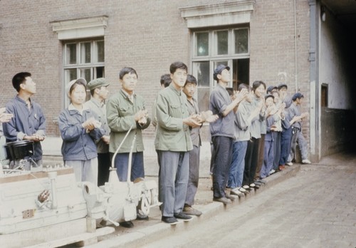 Factory workers welcoming American visitors (1 of 5)