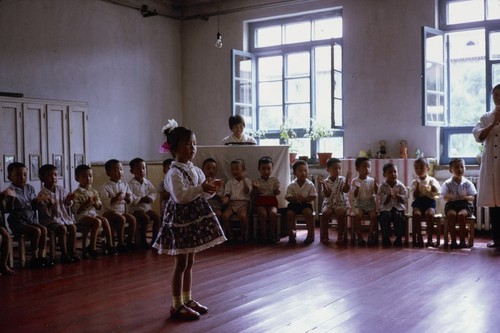 Daycare center visit, girl performing