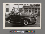 Funeral service for Peter SooHoo, convertible car in the funeral procession with portrait of Peter SooHoo