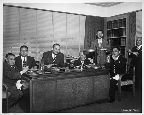 William Knowland and group eating in Y. C. Hong's office