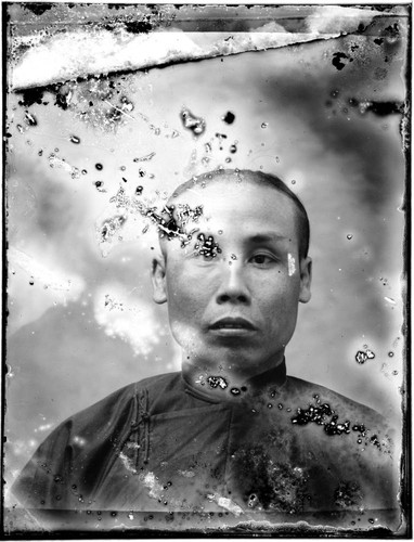 Head-shot portrait of a Chinese man