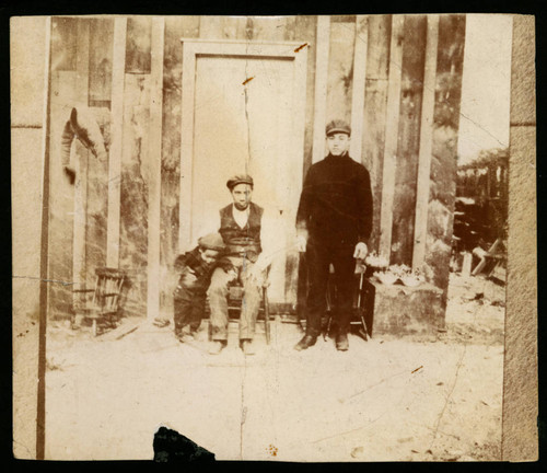 Y. C. Hong (as a toddler), Y. C.'s father, and unidentified man