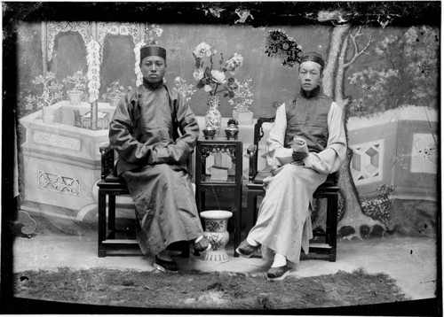 Portrait of two Chinese men, seated