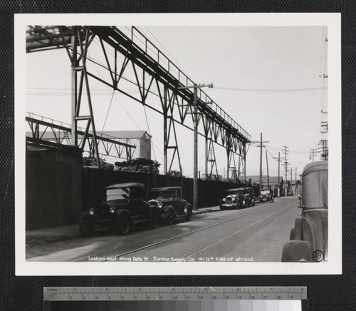 Looking east along Date St. Eureka Supply Co. on left side of street