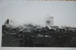 Rock wall from the Sebastopol Feed Co. and burned platform of the adjacent R. M. Wetmore Packing House after a fire at the processing building, about 1943