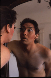 Gilbert Baker applying makeup