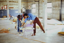 Richard E[vans] and Kim [Hick] Polishing Ceiling Panels