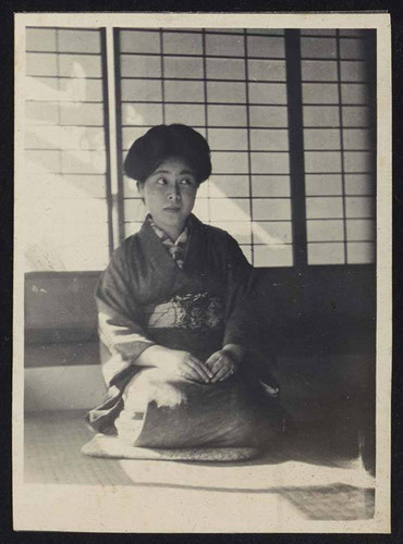 Woman in kimono kneeling