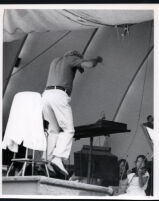 Leonard Bernstein conducting at the podium, Los Angeles, 1985 [descriptive]