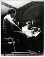 Itzhak Perlman playing the violin with Pinchas Zukerman playing the viola, 1985 [descriptive]