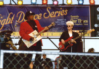 Bo Diddley and an unidentified guitarist performing at the Santa Monica Pier Twilight Dance Series, July 9, 1998 [descriptive]