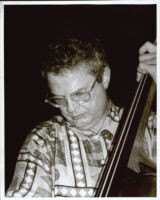 Charlie Haden playing the double bass, Los Angeles [descriptive]