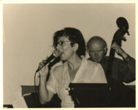 Janis Siegel singing and an unidentified man playing double bass, Los Angeles [descriptive]