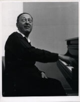 Jascha Heifetz playing the piano, 1966 [descriptive]