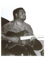 Craig Cooper playing the guitar in Los Angeles [descriptive] — Calisphere