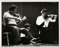 Itzhak Perlman playing the violin with Pinchas Zukerman playing the viola, 1985 [descriptive]