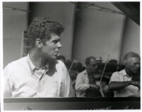 Van Cliburn with orchestra in background, 1958 [descriptive]