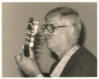 Dori Caymmi playing the guitar in Los Angeles, August 1999 [descriptive]