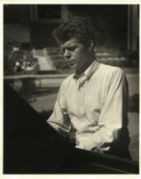 Van Cliburn playing the piano, 1958 [descriptive]