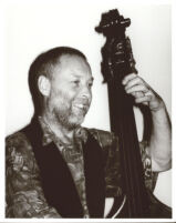 Dave Holland playing the double bass in Los Angeles [descriptive]