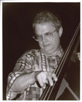 Charlie Haden playing double bass, Los Angeles [descriptive]