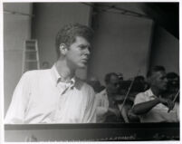 Van Cliburn with orchestra in background, 1958 [descriptive]