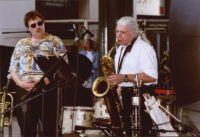 Rob Blakeslee listening as Vinny Golia playing baritone sax, Los Angeles [descriptive]