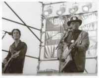 Bo Diddley and an unidentified guitarist performing at the Santa Monica Pier Twilight Dance Series, July 9, 1998 [descriptive]