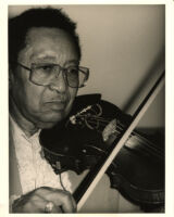 Claude "Fiddler" Williams playing the violin in Los Angeles [descriptive]