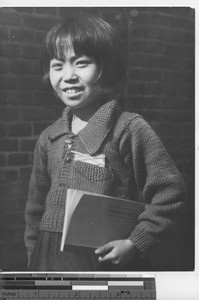 A school girl ready for class at Fushun, China, 1939