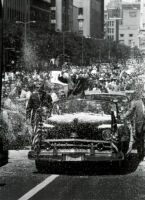 President Eisenhower shields himself from confetti during a parade