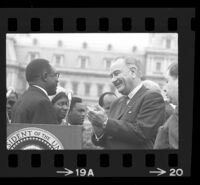 President Lyndon B. Johnson and Upper Voltian President Maurice Yaméogo facing each other, 1965 [19A]